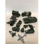 An assortment of playworn vintage military die-cast toys including Dinky.