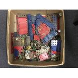 A box of vintage blue and red Meccano.