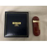 A boxed Ronson enamel and brass lighter.
