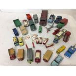 An assortment of playworn vintage die-cast toys including Dinky.