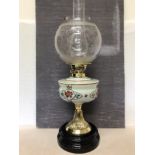 A Victorian oil lamp in working order.