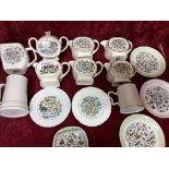 A mixed collection of ceramics including jugs, plates and tankards.