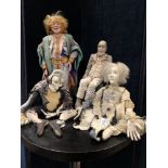Four handcrafted figures originally used as tools during sessions using astrological therapy.