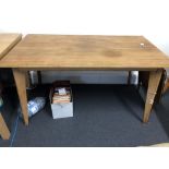 A Morris of Glasgow retro dining table with angled tapering supports.