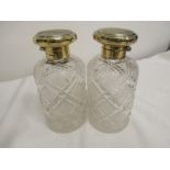 Two1920's silver hallmarked topped large cut glass scent bottles.