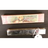 A 1930s harmonica by Rose, in original box.