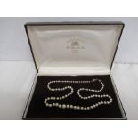 A string of graduated pearls with a 9ct gold clasp.