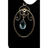 A 9ct yellow gold chain and pendant in an Art Nouveau style set with a light blue amethyst.