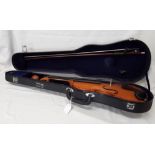 An Andreas Zeller violin, full sized. In a hard carry case. Together with a green fabric violin case