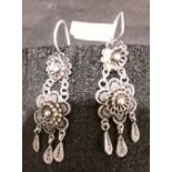 A pair of white precious metal drop earrings