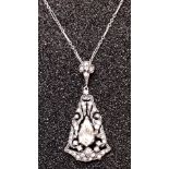 An Art Deco silver pendent set with faux diamonds on a white metal chain.