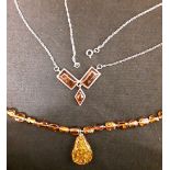 Two amber necklaces.