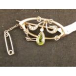 A 9ct yellow gold Art Deco brooch set with a large green peridot.