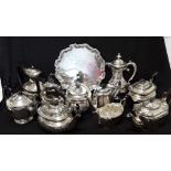 A large assortment of silver-plated tea pots, coffee pots and trays etc. 19 pieces in total.