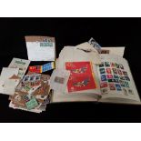 A collection of British (spanning Victoria to Elizabeth II) and world stamps in three albums and loo