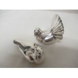 A pair of solid silver doves dated 1999.