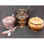 A collection of three antique Chinese wooden rice bowls.
