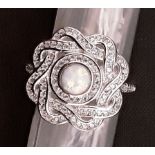 A silver ring set with CZ and opaline panel.