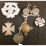 An assortment of brooches and medals.