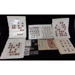 An assortment of British stamps including four pages for collection of plate numbered penny reds.