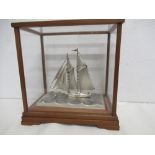 A Seki Takemiko Japanese silver yacht marked (900) in glass case.