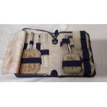 A vintage blue leather lady's vanity case with contents.