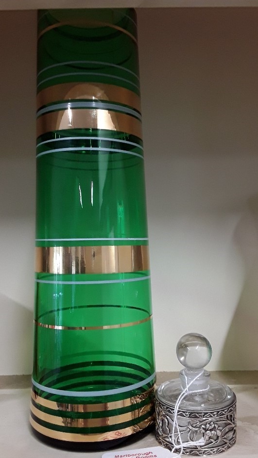 A 1930s green vase together with a white metal and glass scent bottle.