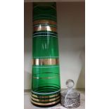 A 1930s green vase together with a white metal and glass scent bottle.