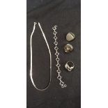 Collection of silver and white metal rings, necklace and bracelet.