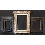 Three wooden antique picture frames.