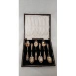 A set of six silver plated teaspoons in a tooled leather box.