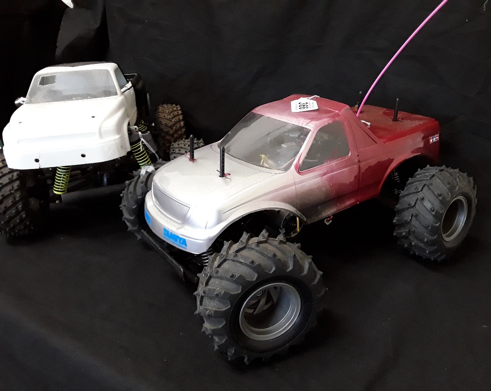 A pair of 1990's Big Foot remote control cars.