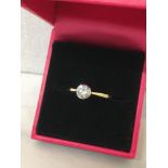 An 18ct yellow gold ring set with a diamond of approximately 51 points.