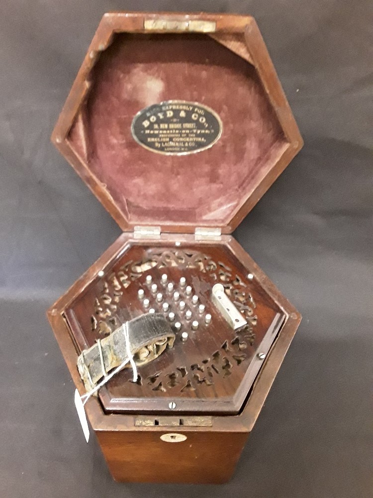 A concertina with 24 Keys to both sides in a box markeda and boyds