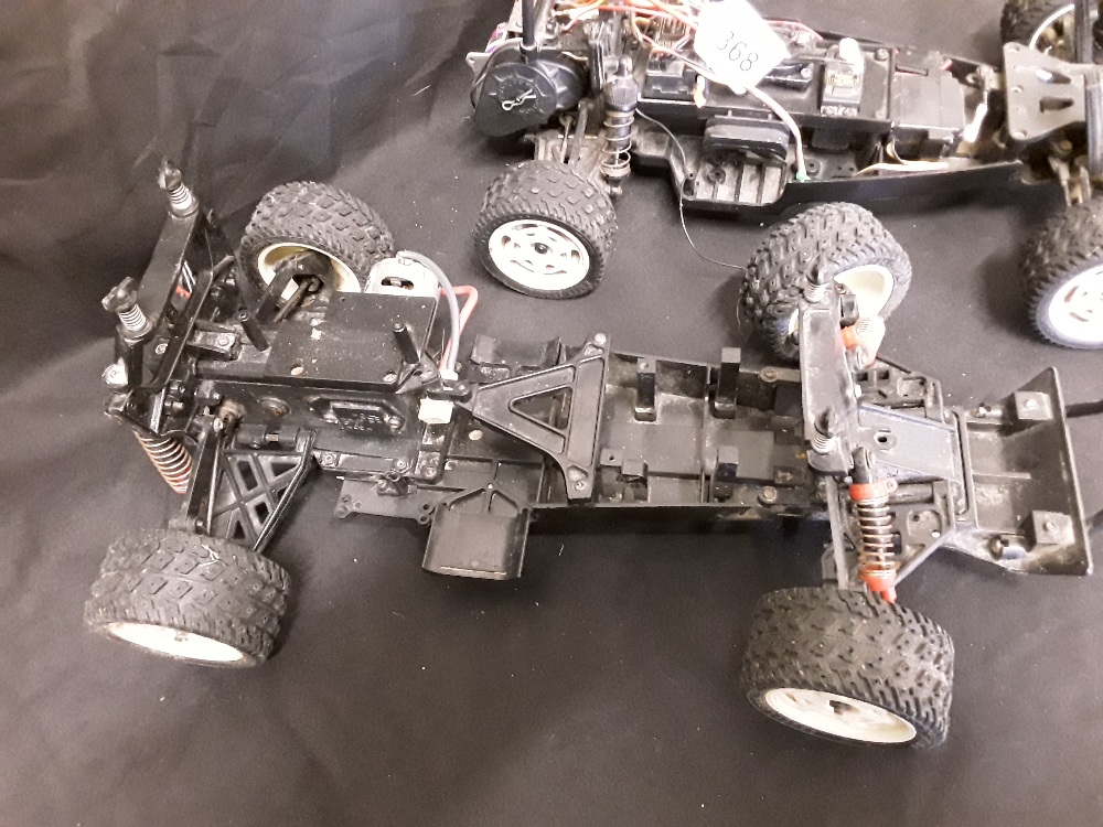 A set of three remote control car chassis including one petrol.