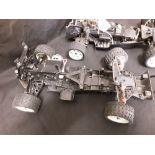 A set of three remote control car chassis including one petrol.