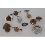 An assortment of ten WW1 and WW2 sweetheart brooches and lapel badges.