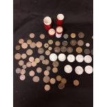 A quantity of coins, tokens and medallions together with two bank tubes.