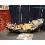 A huge early 20th Century scratch built hardwood model of a Chinese three masted junk.