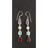 A pair of silver, amethyst, garnet a topaz drop earrings.