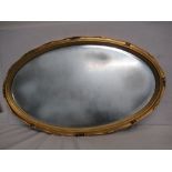 A gilt framed oval mirror, 70cm x 42.5cm.