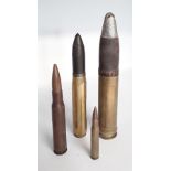 Two inert cannon rounds together with two inert bullets.