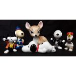 A collection of Snoopy memorabilia and a large Wade Bambi.