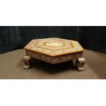 An Indian hexagonal silver wrapped and copper coffee table of small proportions.
