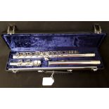 A solid silver flute by "Buffet Crampon Paris" marked 925 to each part.