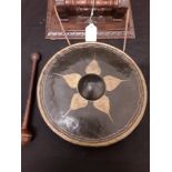 A wall hanging gong.