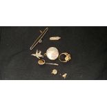 An assortment of brooches together with a gold plated ring and a 14ct gold pen nib.