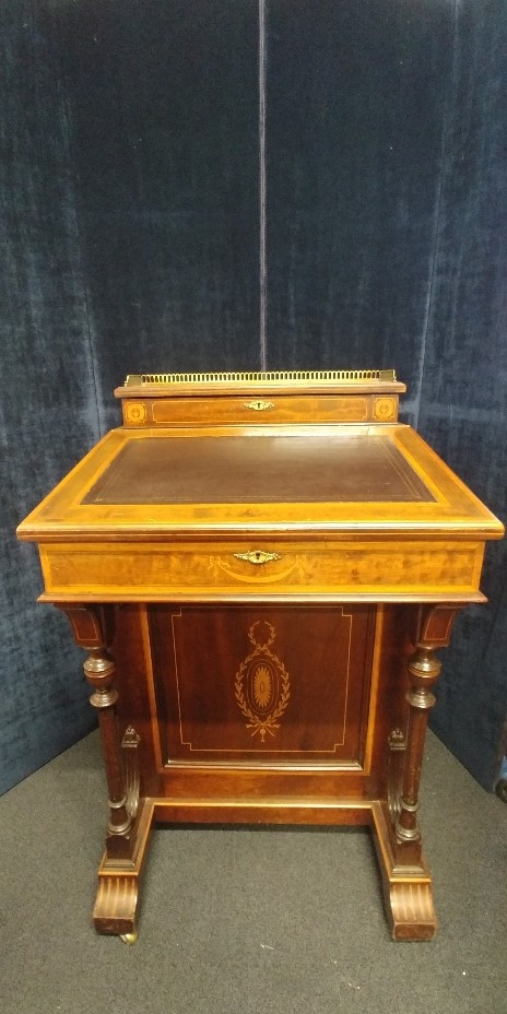 A Davenport desk with marquetry inlay and gallery rail to the top.