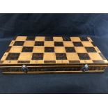 A novelty chess set together with an small chess set constructed from onyx.