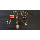 A collection of gold plated jewellery including necklaces, bracelets, earrings etc.